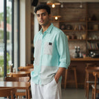 CODE92 aqua and grey linen-cotton blend shirt with a soft collar worn by a man in a cafe setting