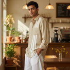 CODE92 light coffee linen cotton shirt with white front panel stripes worn by a man in a cafe setting