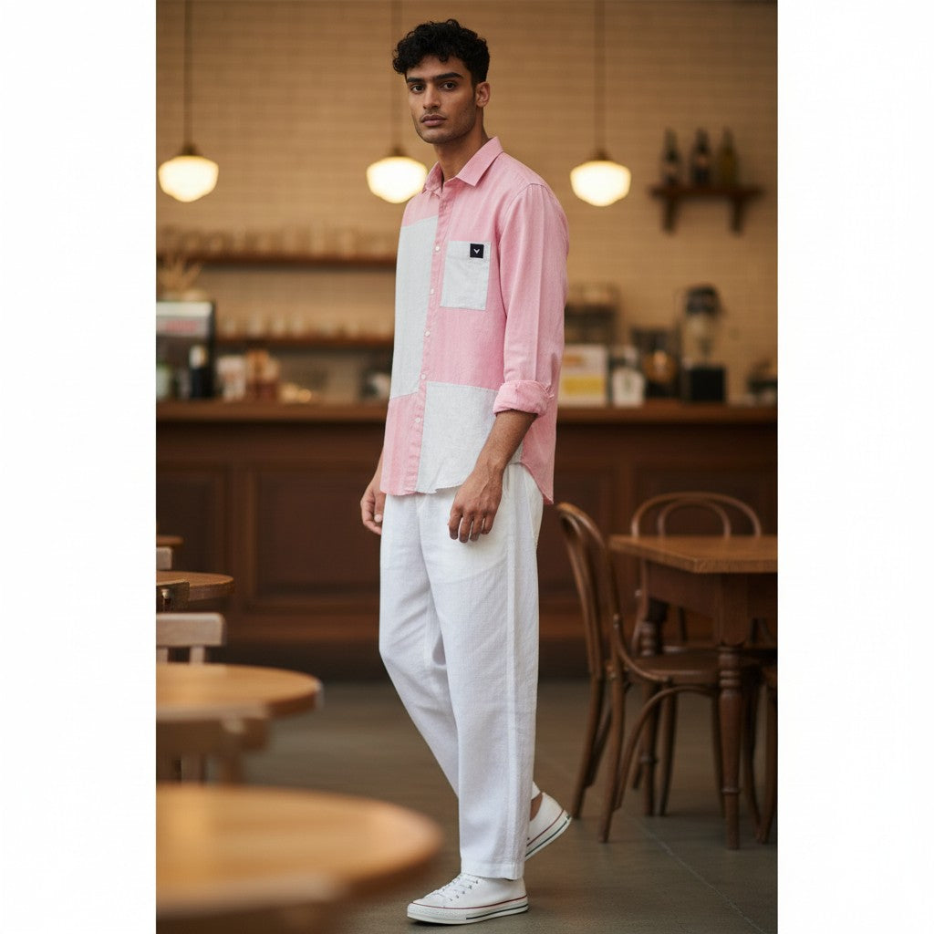 CODE92 pink and white colour-blocked cotton linen shirt with a soft collar worn by a male model in a cafe setting.